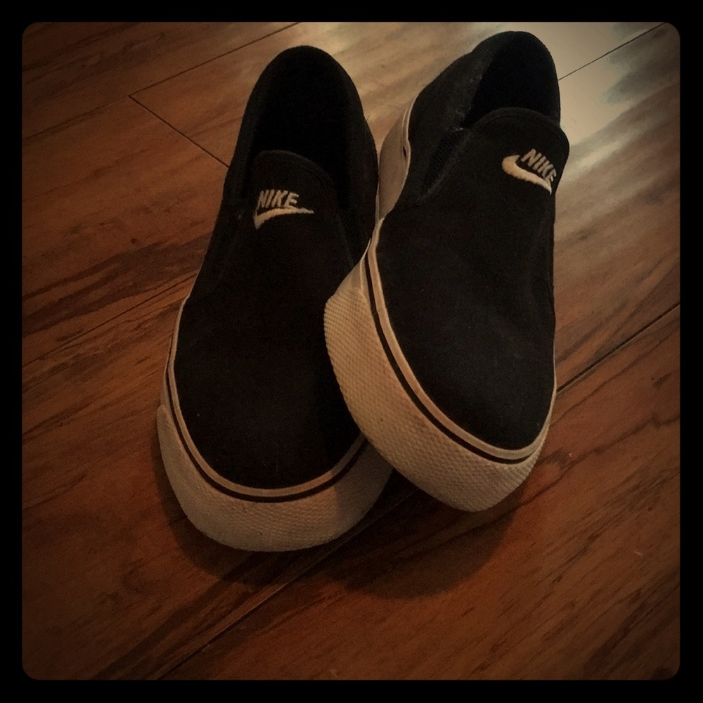 Slip on black nike shoes; canvas material